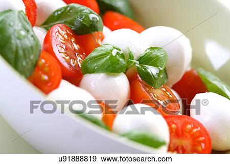 Close of tomato and mozarella in dish View Large Photo Image Stock Photo - Close of tomato and mozarella in dish. Fotosearch