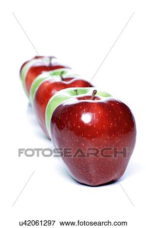 Stock Photo - Close-up of apples in row on white background. Fotosearch