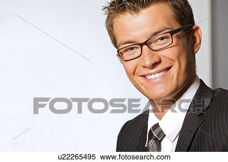 Close-up of businessman and woman shaking hands in office View Large Photo Image Stock Photography - Close-up of businessman and woman shaking hands in office. Fotosearch