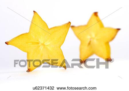 Stock Image - Close-up of carambola on white background. Fotosearch