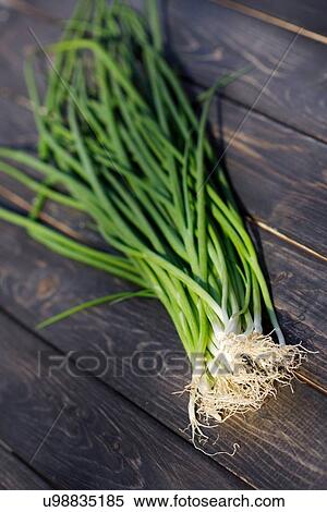 Close up of chives on wooden table View Large Photo Image Stock Photography - Close up of chives on wooden table. Fotosearch