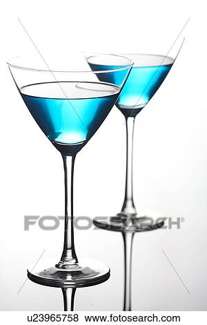 Close up of drinks in martini glasses View Large Photo Image Stock Photo - Close up of drinks in martini glasses. Fotosearch