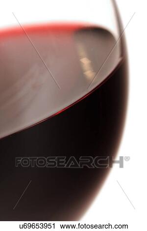 Stock Image - Close-up of glass with red wine. Fotosearch