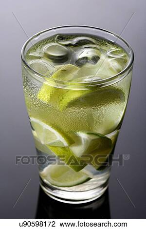 Close up of lemon drink with ice cubes View Large Photo Image Stock Image - Close up of lemon drink with ice cubes. Fotosearch