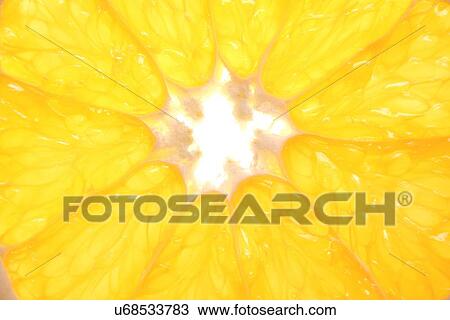 Stock Image - Close - up of orange slice. Fotosearch