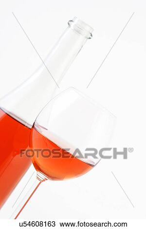 Stock Image - Close-up of rose wine on white background. Fotosearch