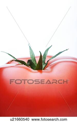 Stock Image - Close-up of tomatoes on white background. Fotosearch