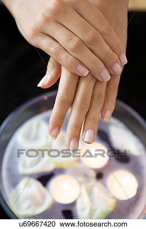 Close-up of woman receiving heat therapy on hand View Large Photo Image Stock Image - Close-up of woman receiving heat therapy on hand. Fotosearch