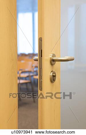 Stock Image - Conference room with ajar door. Fotosearch