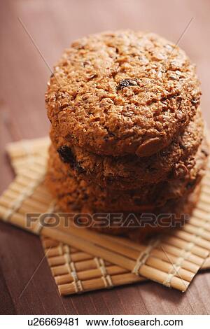 Stock Image - Cookies on wooden mat. Fotosearch