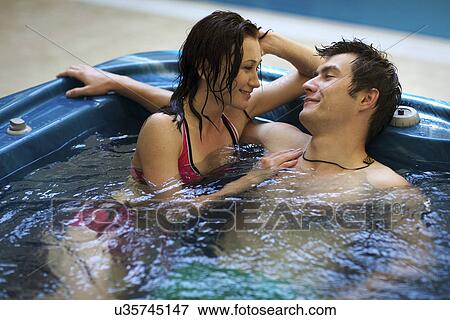 Couple bathing at jacuzzi View Large Photo Image Stock Photo - Couple bathing at jacuzzi. Fotosearch
