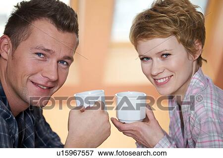 Stock Photo - Couple drinking coffee. Fotosearch