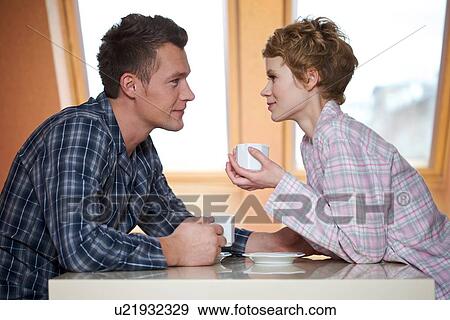 Couple drinking coffee View Large Photo Image Stock Photo - Couple drinking coffee. Fotosearch