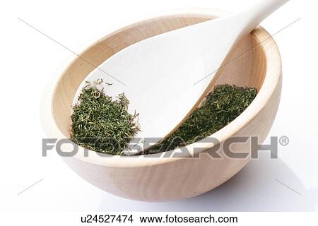Picture - Dried thyme on wooden spoon. Fotosearch