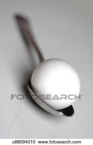 Egg on spoon - studio shot View Large Photo Image Stock Image - Egg on spoon - studio shot. Fotosearch