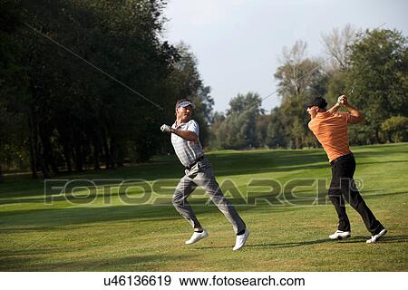 Stock Photo - Friends having fun in golf course. Fotosearch