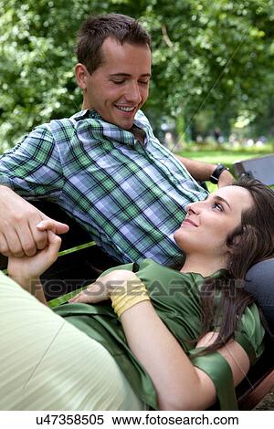 Stock Photography - Girlfriend resting head on boyfriend's lap. Fotosearch