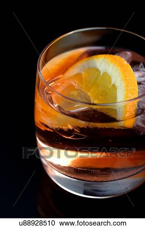 Stock Image - Glass of beverage with ice. Fotosearch