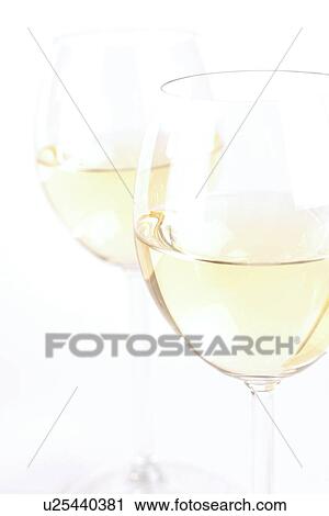 Stock Image - Glass of white wine - studio shot. Fotosearch