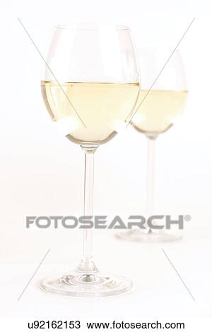 Stock Image - Glass of white wine - studio shot. Fotosearch