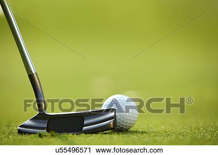 Stock Image - Golf ball on grass. Fotosearch