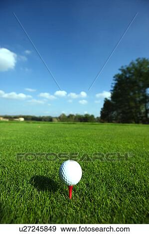 Stock Photo - Golf ball on tee. Fotosearch