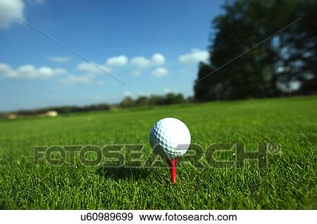 Stock Photo - Golf ball on tee. Fotosearch