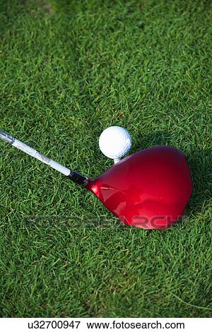 Stock Photo - Golf club hitting a golf ball. Fotosearch
