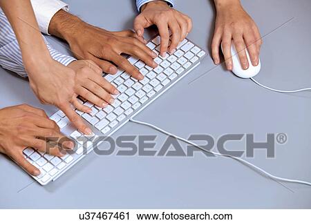 Human hands on computer keyboard with one hand using computer mouse View Large Photo Image Stock Image - Human hands on computer keyboard with one hand using computer mouse. Fotosearch