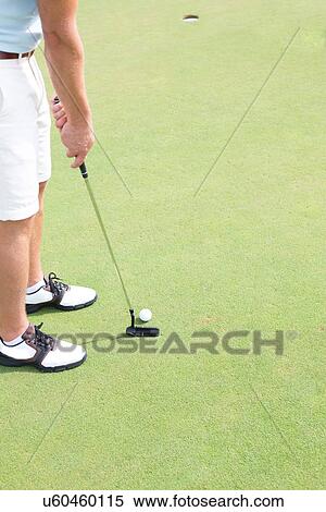Low section of mid-adult man playing golf View Large Photo Image Stock Photography - Low section of mid-adult man playing golf. Fotosearch