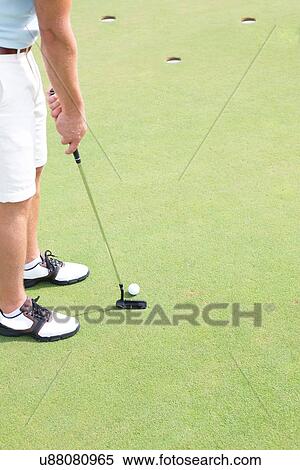 Low section of mid-adult man playing golf View Large Photo Image Stock Photography - Low section of mid-adult man playing golf. Fotosearch
