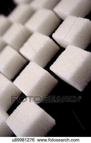 Lump sugar on black background View Large Photo Image Stock Photograph - Lump sugar on black background. Fotosearch