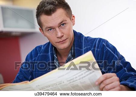 Picture - Man reading newspaper. Fotosearch