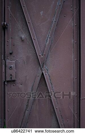 Stock Image - Metal door - close-up. Fotosearch