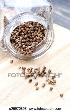 Stock Photo - Mustard seeds in jar - studio shot. Fotosearch