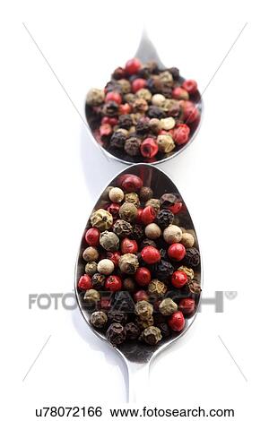 Pepper grains on spoon on white background View Large Photo Image Stock Photograph - Pepper grains on spoon on white background. Fotosearch