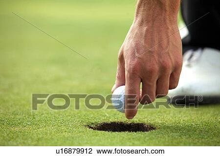 Person holding golf ball, close-up View Large Photo Image Stock Image - Person holding golf ball, close-up. Fotosearch