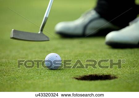 Person playing golf, low section View Large Photo Image Picture - Person playing golf, low section. Fotosearch