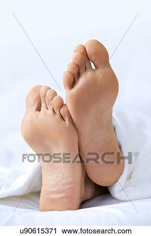Person's foot in bed, close-up View Large Photo Image Stock Image - Person's foot in bed, close-up. Fotosearch