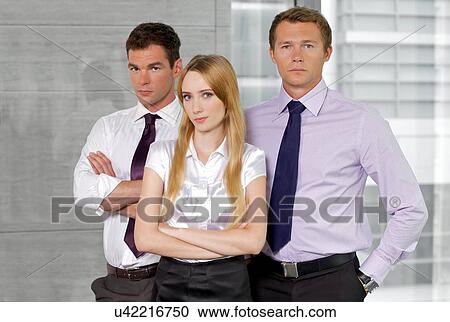 Stock Image - Portrait of business executives at office. Fotosearch