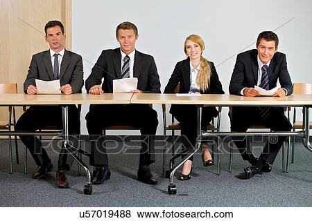 Portrait of business people sitting in office View Large Photo Image Stock Photo - Portrait of business people sitting in office. Fotosearch