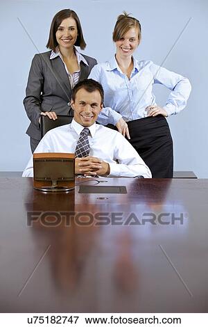 Portrait of business people smiling at office View Large Photo Image Stock Photo - Portrait of business people smiling at office. Fotosearch