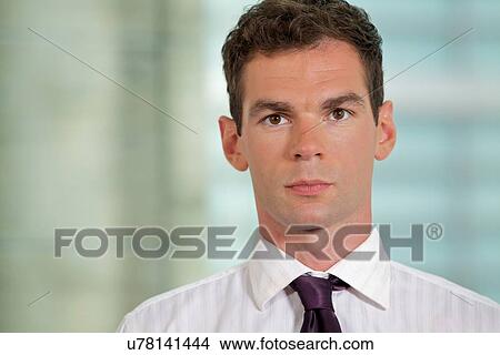 Portrait of businessman at office View Large Photo Image Picture - Portrait of businessman at office. Fotosearch