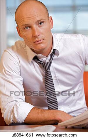 Portrait of businessman at office View Large Photo Image Stock Image - Portrait of businessman at office. Fotosearch