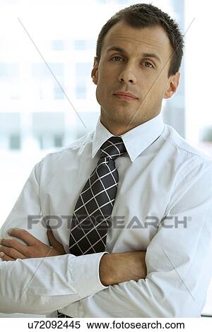 Portrait of businessman with arms crossed View Large Photo Image Stock Photography - Portrait of businessman with arms crossed. Fotosearch