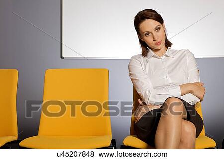 Portrait of businesswoman sitting in waiting room View Large Photo Image Stock Photo - Portrait of businesswoman sitting in waiting room. Fotosearch