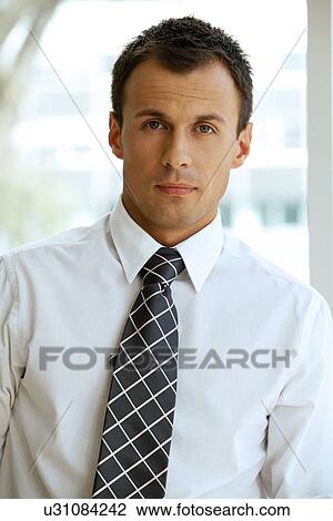 Portrait of bussinessman at office View Large Photo Image Stock Image - Portrait of bussinessman at office. Fotosearch
