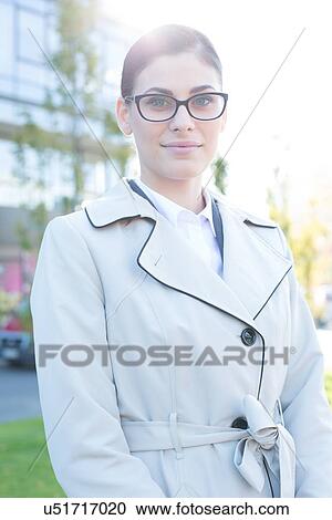 Portrait of confident businesswoman standing outdoors View Large Photo Image Stock Image - Portrait of confident businesswoman standing outdoors. Fotosearch