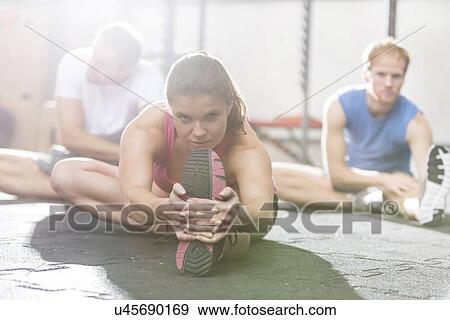 Portrait of confident woman exercising in crossfit gym View Large Photo Image Stock Photo - Portrait of confident woman exercising in crossfit gym. Fotosearch