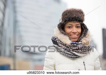 Portrait of happy woman in warm clothing outdoors View Large Photo Image Stock Image - Portrait of happy woman in warm clothing outdoors. Fotosearch